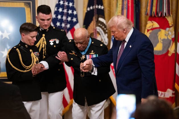 President Donald Trump helps Major James Capers, Jr., during a Medal of Honor ceremony in the East Room of the White House in Washington DC on Thursday, June 18, 2026.  WAX20260618519 AaronxSchwartz