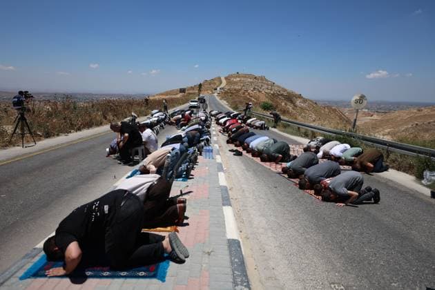 Israeli Forces Disperse Protest During Friday Prayers in Dura DURA, WEST BANK JUNE 19, 2026: Palestinians perform Friday prayers in protest against the seizure of Jabal Tarousa and the establishment of a settlement outpost in the town of Dura, south of Hebron. Israeli forces dispersed the gathering by firing tear gas canisters, causing several Palestinians, including journalists, to suffer from tear gas inhalation. Photo by Mosab Shawer JNA Press. (Photo by Mosab shawer JNA Press via Nexpher Images) DURA