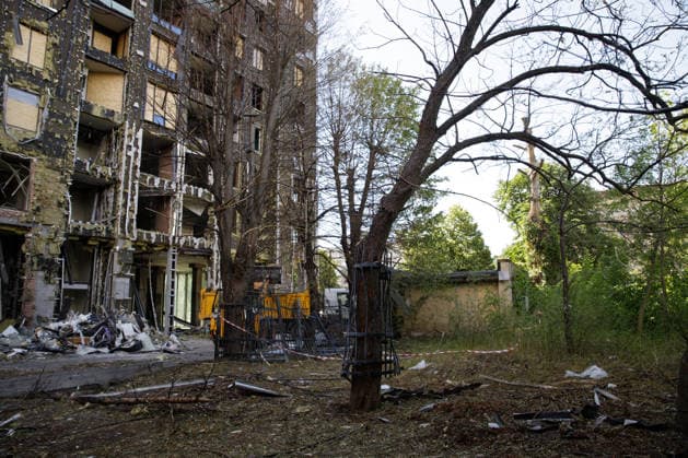 An iron fence ripped out of the ground by the shockwave from the Russian strike is wrapped around a nearby tree at the Oleksandr Dovzhenko National Film Studio, Kyiv, Ukraine, June 19, 2026. The studio sustained considerable damage during the large-scale Russian missile and drone attack on the capital on June 15. The costume shop, which housed the largest and oldest costume collection in Ukraine, suffered the most destruction. Its storage contained around 100,000 costumes created for films across different decades, as well as approximately three million pieces of props. Other buildings of the film studio were also damaged. (Photo by Marianna Kotyk Ukrinform) Volunteers remove debris at Dovzhenko Film Studio in Kyiv  Copyright: xMariannaxKotykx