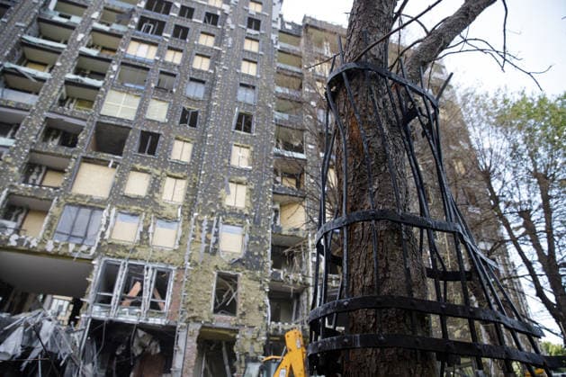 Volunteers Remove Debris at Dovzhenko Film Studio in Kyiv An iron fence ripped out of the ground by the shockwave from the Russian strike is wrapped around a nearby tree at the Oleksandr Dovzhenko National Film Studio, Kyiv, Ukraine, June 19, 2026. The studio sustained considerable damage during the large-scale Russian missile and drone attack on the capital on June 15. The costume shop, which housed the largest and oldest costume collection in Ukraine, suffered the most destruction. Its storage contained around 100,000 costumes created for films across different decades, as well as approximately three million pieces of props. Other buildings of the film studio were also damaged. Photo by Marianna Kotyk Ukrinform ABACAPRESS.COM Kyiv Ukrai  Copyright: xUkrinform ABACAx