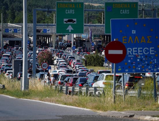 Schengen Entry Exit System North Macedonia and Greece border GEVGELIJA, NORTH MACEDONIA - JUNE 20: A view of the kilometer-long queues of vehicles heading toward Greece at the Evzoni border crossing in Gevgelija, North Macedonia on June 20, 2026. Travelers face hours-long delays amid heavy summer traffic and the implementation of the new Schengen Entry Exit System (EES), which requires the collection of biometric data from passengers. Nake Batev Anadolu Gevgelija North Macedonia. Editorial use only. Please get in touch for any other usage.  Copyright: x2026xAnadoluxNakexBatevx