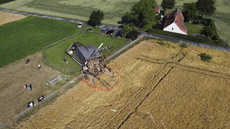 Aerial drone picture shows the historical Huisekouter mill in Kruisem blown away during last nights thunderstorm, Saturday 20 June 2026. Like many European countries, Belgium is experiencing an unusually hot spell for this time of year. The Belgian Royal Meteorological Institute (KMI) issued a code orange warning for heat and severe thunderstorms.  NICOLASxMAETERLINCK 178436544