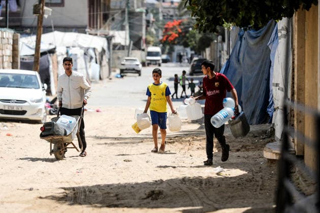 Displaced Palestinians collect water in al-Bureij refugee camp Displaced Palestinians gather to collect water from a distribution point in al-Bureij refugee camp in the central Gaza Strip on June 20, 2026. The water crisis has worsened following the shutdown of some desalination plants due to a shortage of diesel fuel needed for their operation, threatening water security for hundreds of thousands of residents who rely on desalinated water as their primary source of drinking water amid calls for urgent intervention to ensure fuel supplies and maintain the facilities operations. Photo by Moiz Salhi apaimages Nusairat Gaza Strip Palestinian Territory 200626_Bureij_MS_01(16) Copyright: xapaimagesxMoizxSalhixx xapaimagesx