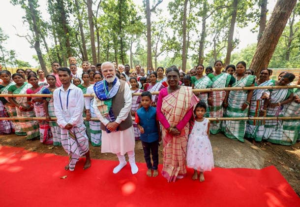 RECORD DATE NOT STATED President Droupadi Murmu and PM Modi pose for a group picture with children during their visit at Pahadpur village, in Mayurbhanj Mayurbhanj Odisha , Jun 20 (ANI): President Droupadi Murmu and Prime Minister Narendra Modi pose for a group picture with children during their visit at Pahadpur village, in Mayurbhanj on Saturday. (@narendramodi X ANI Photo) Mayurbhanj Odisha India Copyright: xANIx ANI_20260620254