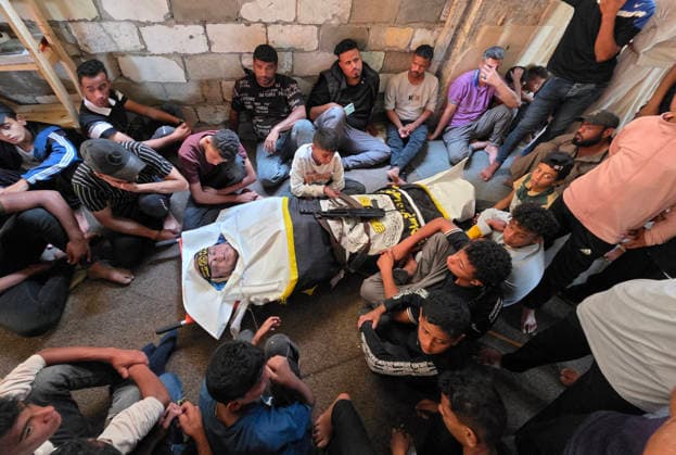 Mourners attend funeral of Islamic Jihad commander in Khan Younis Mourners carry the body of Zaki Abu Mustafa, a commander in the Al-Quds Brigades, the armed wing of Islamic Jihad, during his funeral in Khan Younis, southern Gaza Strip, on June 20, 2026. Abu Mustafa was killed in an Israeli drone strike that targeted tents sheltering displaced Palestinians in the al-Mawasi area, west of Khan Younis, on the previous evening. Photo by Tariq Mohammad APA Images Khan Yunis Gaza Strip Palestinian Territory 200626_Khan_Yunis_TM_01(11) Copyright: xapaimagesxTariqxMohammad xapaimagesx