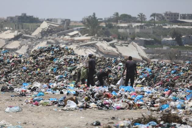 Displaced Families Endure Harsh Conditions in Bureij Refugee Camp GAZA STRIP JUNE 2026: Displaced Palestinians live in difficult conditions beside piles of accumulated waste in Bureij refugee camp. Children search through discarded materials in an attempt to find items that can help support their families amid worsening humanitarian conditions and limited access to basic necessities. BUREIJ PS Copyright: x xRamzixAbuxAmerx xJNAxPressx