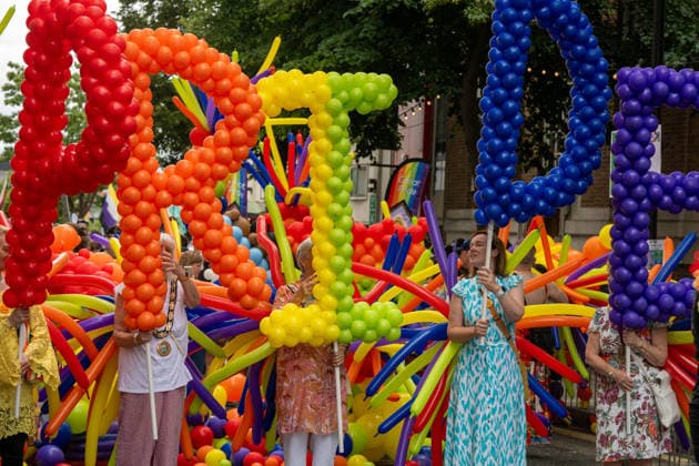 June 20, 2026, Essex, United Kingdom: Participants carry large colourful balloon letters during the Essex Pride. Essex Pride is a celebration of lesbian, gay, bisexual and transgender life in Essex and beyond, led by Cheryl Hole, also known as Cheryl the Queen. Essex United Kingdom - ZUMAs197 20260620_aaa_s197_097 Copyright: xIanxDavidsonx