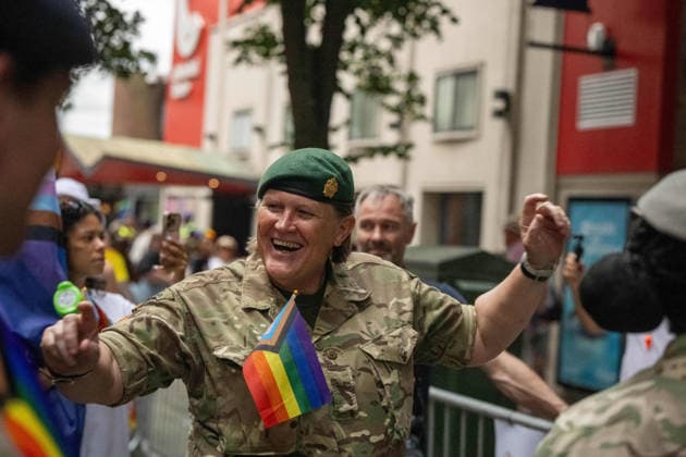 June 20, 2026, Essex, United Kingdom: A woman in military uniform and green beret smiles and holds a rainbow flag during the Essex Pride. Essex Pride is a celebration of lesbian, gay, bisexual and transgender life in Essex and beyond, led by Cheryl Hole, also known as Cheryl the Queen. Essex United Kingdom - ZUMAs197 20260620_aaa_s197_099 Copyright: xIanxDavidsonx