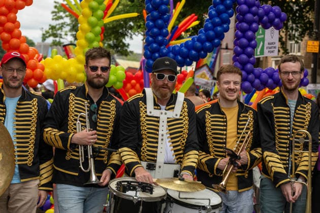 June 20, 2026, Essex, United Kingdom: Members of a marching band in black and gold military-style uniforms pose with their instruments during the Essex Pride. Essex Pride is a celebration of lesbian, gay, bisexual and transgender life in Essex and beyond, led by Cheryl Hole, also known as Cheryl the Queen. Essex United Kingdom - ZUMAs197 20260620_aaa_s197_104 Copyright: xIanxDavidsonx