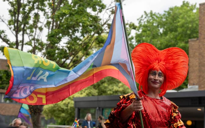 June 20, 2026, Essex, United Kingdom: A performer on stilts wears an elaborate red heart-shaped headpiece and sequinned costume while holding a flag during the Essex Pride. Essex Pride is a celebration of lesbian, gay, bisexual and transgender life in Essex and beyond, led by Cheryl Hole, also known as Cheryl the Queen. Essex United Kingdom - ZUMAs197 20260620_aaa_s197_106 Copyright: xIanxDavidsonx
