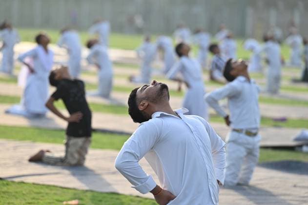 GURUGRAM, INDIA - JUNE 20: People perform yoga during the Yoga Protocol rehearsal ahead of the 12th International Day of Yoga at Tau Devi Lal Stadium, sector-38 near Rajiv Chowk, on June 20, 2026 in Gurugram, India. (Photo by Parveen Kumar Hindustan Times ) Yoga Protocol Rehearsal Ahead Of 12th International Day Of Yoga At Tau Devi Lal Stadium