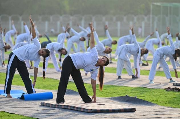 GURUGRAM, INDIA - JUNE 20: People perform yoga during the Yoga Protocol rehearsal ahead of the 12th International Day of Yoga at Tau Devi Lal Stadium, sector-38 near Rajiv Chowk, on June 20, 2026 in Gurugram, India. (Photo by Parveen Kumar Hindustan Times ) Yoga Protocol Rehearsal Ahead Of 12th International Day Of Yoga At Tau Devi Lal Stadium