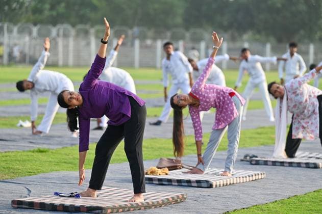 GURUGRAM, INDIA - JUNE 20: People perform yoga during the Yoga Protocol rehearsal ahead of the 12th International Day of Yoga at Tau Devi Lal Stadium, sector-38 near Rajiv Chowk, on June 20, 2026 in Gurugram, India. (Photo by Parveen Kumar Hindustan Times ) Yoga Protocol Rehearsal Ahead Of 12th International Day Of Yoga At Tau Devi Lal Stadium