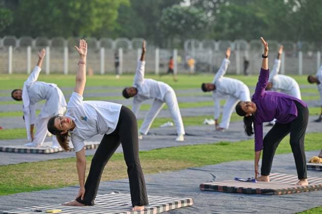 GURUGRAM, INDIA - JUNE 20: People perform yoga during the Yoga Protocol rehearsal ahead of the 12th International Day of Yoga at Tau Devi Lal Stadium, sector-38 near Rajiv Chowk, on June 20, 2026 in Gurugram, India. (Photo by Parveen Kumar Hindustan Times ) Yoga Protocol Rehearsal Ahead Of 12th International Day Of Yoga At Tau Devi Lal Stadium
