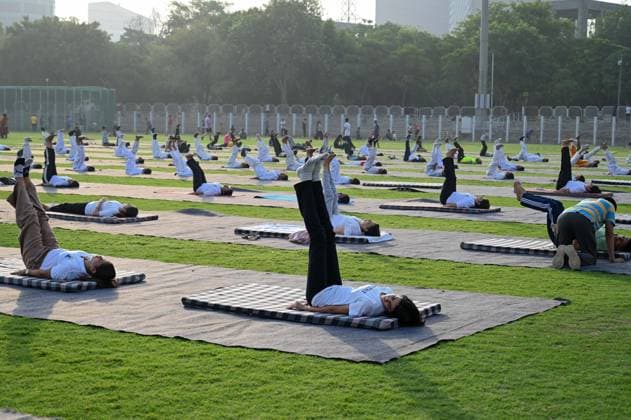 GURUGRAM, INDIA - JUNE 20: People perform yoga during the Yoga Protocol rehearsal ahead of the 12th International Day of Yoga at Tau Devi Lal Stadium, sector-38 near Rajiv Chowk, on June 20, 2026 in Gurugram, India. (Photo by Parveen Kumar Hindustan Times ) Yoga Protocol Rehearsal Ahead Of 12th International Day Of Yoga At Tau Devi Lal Stadium