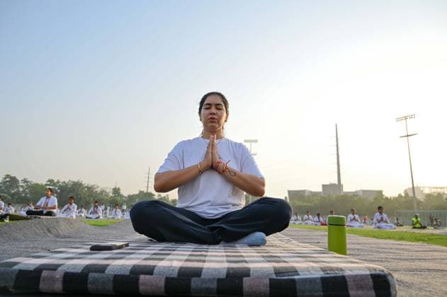 GURUGRAM, INDIA - JUNE 20: People perform yoga during the Yoga Protocol rehearsal ahead of the 12th International Day of Yoga at Tau Devi Lal Stadium, sector-38 near Rajiv Chowk, on June 20, 2026 in Gurugram, India. (Photo by Parveen Kumar Hindustan Times ) Yoga Protocol Rehearsal Ahead Of 12th International Day Of Yoga At Tau Devi Lal Stadium