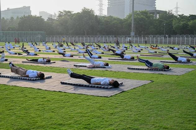 GURUGRAM, INDIA - JUNE 20: People perform yoga during the Yoga Protocol rehearsal ahead of the 12th International Day of Yoga at Tau Devi Lal Stadium, sector-38 near Rajiv Chowk, on June 20, 2026 in Gurugram, India. (Photo by Parveen Kumar Hindustan Times ) Yoga Protocol Rehearsal Ahead Of 12th International Day Of Yoga At Tau Devi Lal Stadium
