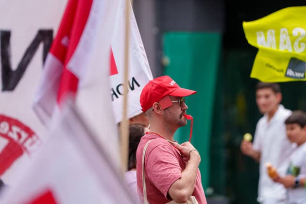 Trade Unions Protest Against Social Spending Cuts Germany - Kassel, 20.06.2026 Man with red cap and whistle, as participants march through Kassel during a trade union demonstration against proposed social spending cuts. The rally, organised under the slogan Kürzen nicht mit uns ( Cuts? Not on us! ), began at Kassel Central Station and concluded with speeches at Königsplatz. Demonstrators called for increased public investment and warned against reductions in welfare, healthcare and education funding. The protest was supported by the German Trade Union Confederation (DGB), the United Services Union (ver.di) and the Education and Science Workers Union (GEW), alongside local activists and workers. Hesse