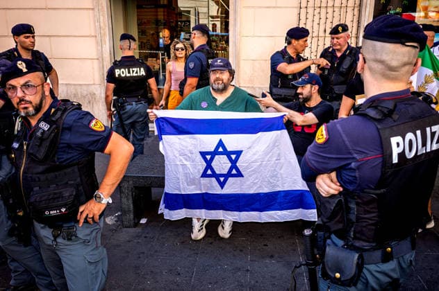 Rome Pride Parade 2026 ROME, ITALY - JUNE 20: Mario Adinolfi, holding an Israeli flag a journalist and politician was detained by the police whilst attempting to protest against Roma Pride, during the 32st edition of the Pride Parade in support of LGBTQ rights on June 20 2026 in Rome, Italy. Rome Italy Copyright: xStefanoxMontesix