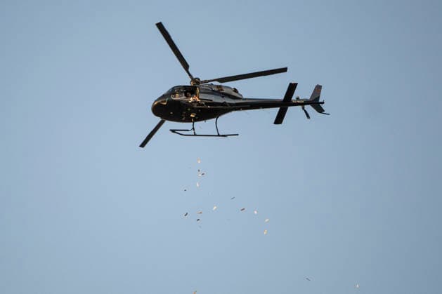 Barcelona celebrates the 50th anniversary of the end of the dictatorship with a poem bombardment over the Cathedral. A helicopter drops poems during the poem bombardment event to celebrate the 50th anniversary of the end of the dictatorship, near the Cathedral on June 20, 2026, in Barcelona, Catalonia, Spain. A helicopter will drop 100,000 poems in the form of bookmarks, which people can pick up off the ground. The event is intended as a symbolic and pacifist act to transform a space historically associated with fascist bombings during the Civil War into a place of culture and remembrance. JUNE 20, 2026 Lorena Sopê Barcelona, Catalonia Barcelona, Catalonia, Spain,detected_source_language  Copyright: xLorenaxSopÃªnax 7612353