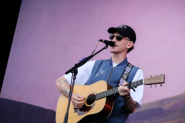 June 20, 2026, Newport, United Kingdom: Scottish singer songwriter Nathan Evans born Nathan Alexander Evans, performing live on stage with The Saint PHNX Band at the Isle of Wight festival. He first gained fame in 2020 by posting videos of himself singing sea shanties on TikTok. In 2021, he released a version of the folk song Wellerman which peaked at the top of the UK Singles Chart. The Saint PHNX Band is currently Nathan Evans Lead vocals and acoustic guitar., Stevie Jukes Lead vocals, guitar, and bass, Alan Jukes Backing vocals, drums, and percussion Newport United Kingdom - ZUMAs197 20260620_aaa_s197_166 Copyright: xDawnxFletcher-Parkx