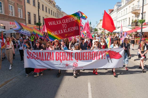 June 20, 2026, Warsaw, Masovian Voivodeship, Poland: People carry a large banner that reads socialism will be queer! along with a red and rainbow banner that reads queer struggle is class struggle in a socialist bloc during Warsaw s first ever radical Pride parade. Called Equality Parade - Queer Liberation March in Polish, the grassroots march was organized by a collective of radical LGBTQ+ activists as an anti-capitalist alternative to Warsaw s traditional Pride parade, which has recently become dominated by corporate sponsors. Warsaw Poland - ZUMAk204 20260620_zip_k204_010 Copyright: xRomanxKozielx
