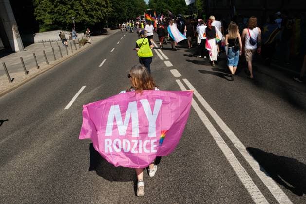 June 20, 2026, Warsaw, Masovian Voivodeship, Poland: A person with a We, Parents (a Polish organization of parents of LGTBQ+ children) marches in Warsaw s first ever radical Pride parade. Called Equality Parade - Queer Liberation March in Polish, the grassroots march was organized by a collective of radical LGBTQ+ activists as an anti-capitalist alternative to Warsaw s traditional Pride parade, which has recently become dominated by corporate sponsors. Warsaw Poland - ZUMAk204 20260620_zip_k204_020 Copyright: xRomanxKozielx