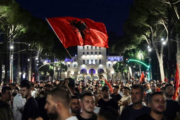 Thousands Gather in Tirana for Day 21 of Anti-Kushner Protests TIRANA, ALBANIA JUNE 20, 2026: Thousands of demonstrators gather in central Tirana during the twenty-first consecutive day of protests against a proposed luxury tourism development project linked to Jared Kushner. The rally drew one of the largest crowds since the movement began in late May, including members of the Albanian diaspora who traveled from across Europe and beyond to take part. Protesters marched through the capital carrying banners, placards, and Albanian flags while calling for the cancellation of the project and expressing concerns over its potential environmental impact on protected coastal areas. Tirana Albania Copyright: x xVlasovxSulajx xJNAxPressx