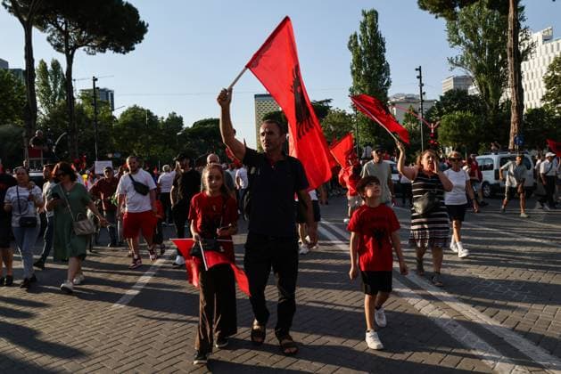 Thousands Gather in Tirana for Day 21 of Anti-Kushner Protests TIRANA, ALBANIA JUNE 20, 2026: Thousands of demonstrators gather in central Tirana during the twenty-first consecutive day of protests against a proposed luxury tourism development project linked to Jared Kushner. The rally drew one of the largest crowds since the movement began in late May, including members of the Albanian diaspora who traveled from across Europe and beyond to take part. Protesters marched through the capital carrying banners, placards, and Albanian flags while calling for the cancellation of the project and expressing concerns over its potential environmental impact on protected coastal areas. Tirana Albania Copyright: x xVlasovxSulajx xJNAxPressx