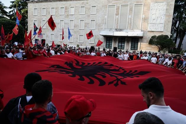 Thousands Gather in Tirana for Day 21 of Anti-Kushner Protests TIRANA, ALBANIA JUNE 20, 2026: Thousands of demonstrators gather in central Tirana during the twenty-first consecutive day of protests against a proposed luxury tourism development project linked to Jared Kushner. The rally drew one of the largest crowds since the movement began in late May, including members of the Albanian diaspora who traveled from across Europe and beyond to take part. Protesters marched through the capital carrying banners, placards, and Albanian flags while calling for the cancellation of the project and expressing concerns over its potential environmental impact on protected coastal areas. Tirana Albania Copyright: x xVlasovxSulajx xJNAxPressx