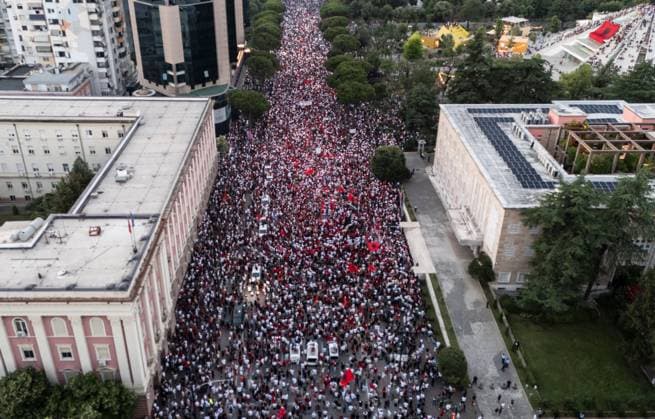 Thousands Gather in Tirana for Day 21 of Anti-Kushner Protests TIRANA, ALBANIA JUNE 20, 2026: Thousands of demonstrators gather in central Tirana during the twenty-first consecutive day of protests against a proposed luxury tourism development project linked to Jared Kushner. The rally drew one of the largest crowds since the movement began in late May, including members of the Albanian diaspora who traveled from across Europe and beyond to take part. Protesters marched through the capital carrying banners, placards, and Albanian flags while calling for the cancellation of the project and expressing concerns over its potential environmental impact on protected coastal areas. Tirana Albania Copyright: x xVlasovxSulajx xJNAxPressx