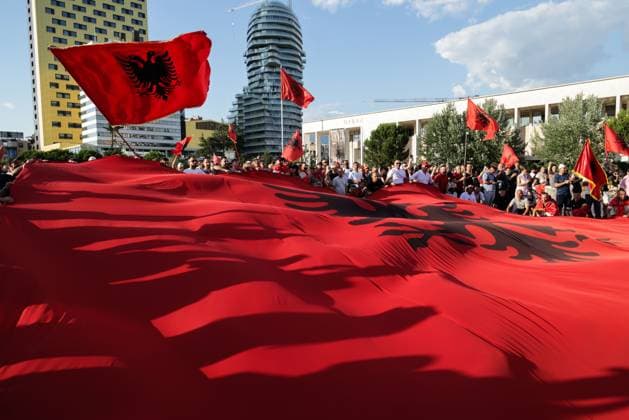 Thousands Gather in Tirana for Day 21 of Anti-Kushner Protests TIRANA, ALBANIA JUNE 20, 2026: Thousands of demonstrators gather in central Tirana during the twenty-first consecutive day of protests against a proposed luxury tourism development project linked to Jared Kushner. The rally drew one of the largest crowds since the movement began in late May, including members of the Albanian diaspora who traveled from across Europe and beyond to take part. Protesters marched through the capital carrying banners, placards, and Albanian flags while calling for the cancellation of the project and expressing concerns over its potential environmental impact on protected coastal areas. Tirana Albania Copyright: x xVlasovxSulajx xJNAxPressx