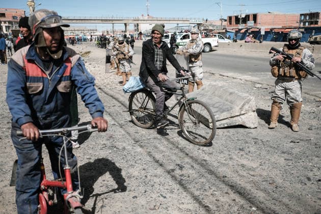 Bolivian president declares state of emergency amid blockade crisis EL ALTO, BOLIVIA - JUNE 20: Two people on bicycles travel through a militarized control zone after Bolivian President Rodrigo Paz declared a state of emergency following 50 days of blockades, in El Alto, Bolivia, on June 20, 2026. Jorge Mateo Romay Salinas Anadolu La Paz Bolivia. Editorial use only. Please get in touch for any other usage.  Copyright: x2026xAnadoluxJorgexMateoxRomayxSalinasx