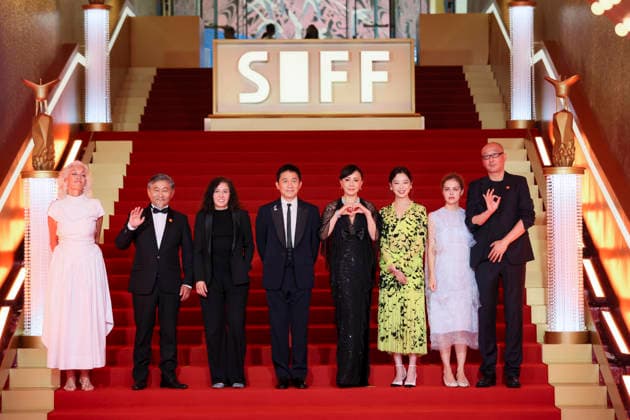 SHANGHAI, CHINA - JUNE 20: Jury members actor Tony Leung Chiu-wai and his wife Carina Lau Kar-ling, producer Dora Bouchoucha Fourati, director Guan Hu, director Aktan Abdykalykov, director-screenwriter Dea Kulumbegashvili, screenwriter Fernanda Valadez and actress Xin Zhilei arrive at the red carpet of the closing ceremony for the 28th Shanghai International Film Festival on June 20, 2026 in Shanghai, China.  Copyright: xVCGx 111649394343