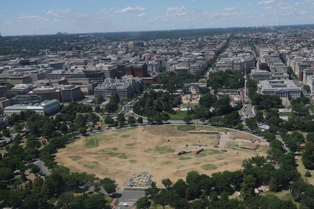 WASHINGTON, D.C. - JUNE 20: Workers clean the DC Ellipse lawn after the UFC Freedom 250 event on June 20, 2026 in Washington D.C. Copyright: xmpi34x