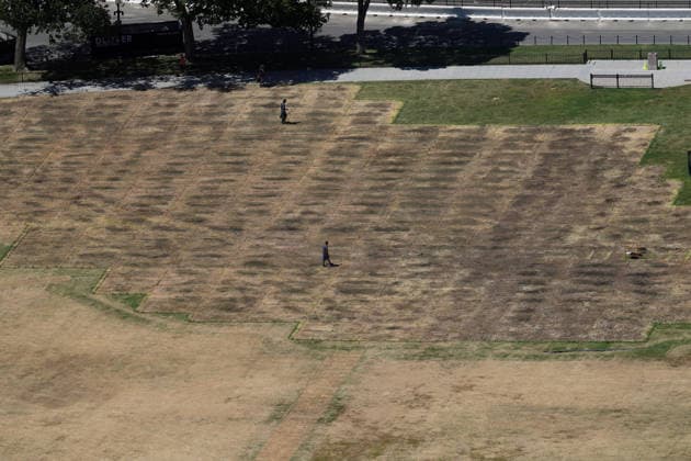 WASHINGTON, D.C. - JUNE 20: Workers clean the DC Ellipse lawn after the UFC Freedom 250 event on June 20, 2026 in Washington D.C. Copyright: xmpi34x