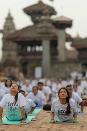 (260621) -- BHAKTAPUR, June 21, 2026 -- People take part in a yoga session to celebrate the International Day of Yoga in Bhaktapur, Nepal, on June 21, 2026. (Photo by Xinhua) NEPAL-BHAKTAPUR-INT L YOGA DAY SulavxShrestha 