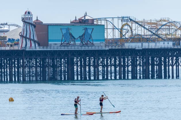 June 21, 2026, Brighton, UK: London, UK. Sunseekers cool off in the sea as they enjoy the warm sunshine on Brighton Beach, East Sussex today as weather forecasters predict another heatwave for the South of the country. The Met Office has issued Amber alerts for Ã¢â‚¬ËœExtreme HeatÃ¢â‚¬â ¢ today with highs of over 38c for London and the South East by Wednesday. Brighton UK  - ZUMAl94_ 20260621_zaf_l94_006 Copyright: xAlexxLentatix