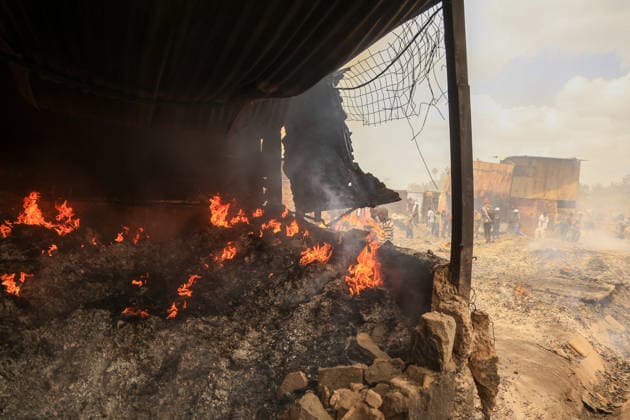 Blaze destroys shops at Nairobi s Gikomba Market NAIROBI, KENYA - JUNE 21: A view of burning stucture as people inspect the damage and try to salvage their belongings after a fire broke out at Gikomba Market in Nairobi, Kenya, on June 21, 2026. Numerous shops were destroyed in the blaze as firefighters worked to contain the fire. Lucas Mukasa Anadolu Nairobi Kenya. Editorial use only. Please get in touch for any other usage.  Copyright: x2026xAnadoluxLucasxMukasax