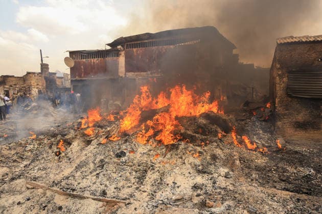Blaze destroys shops at Nairobi s Gikomba Market NAIROBI, KENYA - JUNE 21: A view of burning stucture as people inspect the damage and try to salvage their belongings after a fire broke out at Gikomba Market in Nairobi, Kenya, on June 21, 2026. Numerous shops were destroyed in the blaze as firefighters worked to contain the fire. Lucas Mukasa Anadolu Nairobi Kenya. Editorial use only. Please get in touch for any other usage.  Copyright: x2026xAnadoluxLucasxMukasax