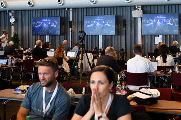 (260621) -- BUERGENSTOCK, June 21, 2026 -- Reporters watch live feed at the press center near Buergenstock mountain resort in Buergenstock near Lucerne, Switzerland, June 21, 2026. U.S. and Iranian negotiators started talks Sunday at Buergenstock mountain resort in central Switzerland on implementing a memorandum of understanding signed by the two sides to reach a final deal. ) (SpotNews)SWITZERLAND-BUERGENSTOCK-U.S.-IRAN TALKS LianxYi 