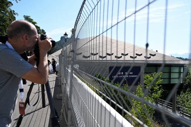 (260621) -- BUERGENSTOCK, June 21, 2026 -- A journalist is seen in Buergenstock near Lucerne, Switzerland, June 21, 2026. U.S. and Iranian negotiators started talks Sunday at Buergenstock mountain resort in central Switzerland on implementing a memorandum of understanding signed by the two sides to reach a final deal. ) (SpotNews)SWITZERLAND-BUERGENSTOCK-U.S.-IRAN TALKS LianxYi 
