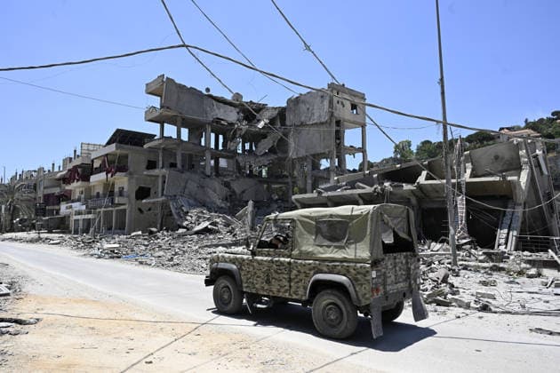 Israeli airstrikes destroy Central Bank branch in southern Lebanon s Nabatieh NABATIEH, LEBANON - JUNE 21: Security forces take extensive measures after Israeli airstrikes hit the city of Nabatieh, in southern Lebanon on June 21, 2026. The airstrikes completely destroyed the Nabatieh branch building of the Central Bank of Lebanon and caused severe damage to numerous surrounding structures. Houssam Shbaro Anadolu Nabatieh Lebanon. Editorial use only. Please get in touch for any other usage.  Copyright: x2026xAnadoluxHoussamxShbarox
