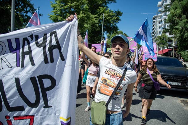 June 21, 2026, Istanbul, Istanbul, Turkey: Activists participate in the 12th Trans Pride March in the Kadikoy district of Istanbul, Turkey, on June 21, 2026. Following the conclusion of the march and after participants had dispersed, police detained several people, including journalists covering the event. The annual march was organized to raise awareness of transgender rights and issues affecting the LGBTQ+ community. Istanbul Turkey  - ZUMAt171 20260621_zip_t171_027 Copyright: xAbdullahxTepelix