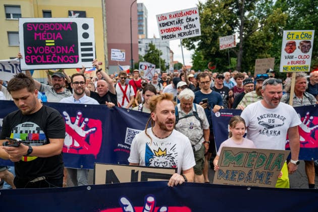 Chairman of the association Million Moments for Democracy, activist Mikulas Minar, center, is seen during the march and demonstration staged by group Million Moments for Democracy in front of the Czech Television in Prague, calling for dismissal of Culture Minister Oto Klempir (Motorists) and in support of public media, on June 21, 2026, Prague, Czech Republic. (CTKxPhoto OndrejxDeml) CTKPhotoP2026062104457  CTKPhotoP2026062104457