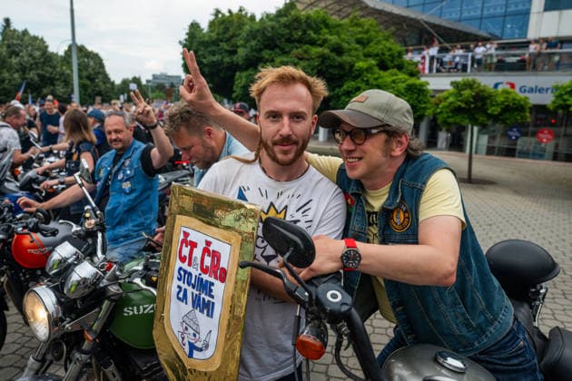 Chairman of the association Million Moments for Democracy, activist Mikulas Minar, center, is seen during the march and demonstration staged by group Million Moments for Democracy in front of the Czech Television in Prague, calling for dismissal of Culture Minister Oto Klempir (Motorists) and in support of public media, on June 21, 2026, Prague, Czech Republic. (CTKxPhoto OndrejxDeml) CTKPhotoP2026062104590  CTKPhotoP2026062104590