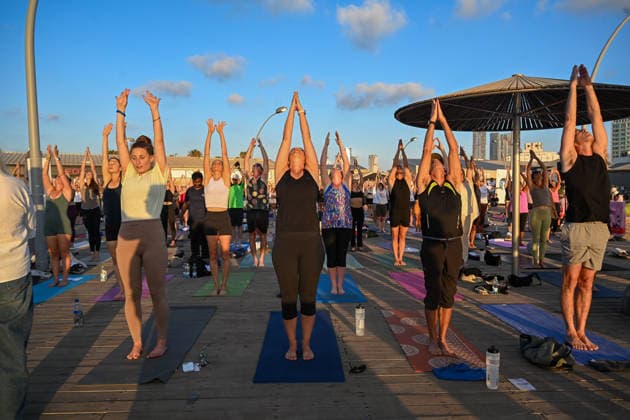 June 21, 2026, Tel-Aviv, Tel-Aviv, Israel: Hundreds of participants practice yoga during International Yoga Day at the Tel Aviv Port in Tel Aviv, joining an open public session featuring 108 Sun Salutations (Surya Namaskar), a traditional sequence symbolizing mindfulness, endurance and gratitude. Tel-Aviv Israel - ZUMAp227 20260621_zip_p227_010 Copyright: xPaulinaxPatimerx