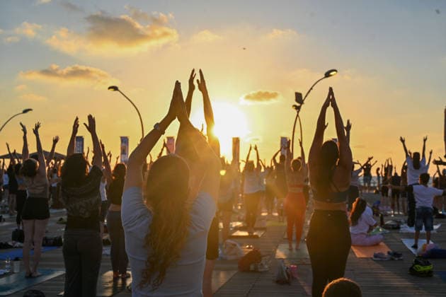 June 21, 2026, Tel-Aviv, Tel-Aviv, Israel: Hundreds of participants practice yoga during International Yoga Day at the Tel Aviv Port in Tel Aviv, joining an open public session featuring 108 Sun Salutations (Surya Namaskar), a traditional sequence symbolizing mindfulness, endurance and gratitude. Tel-Aviv Israel - ZUMAp227 20260621_zip_p227_012 Copyright: xPaulinaxPatimerx