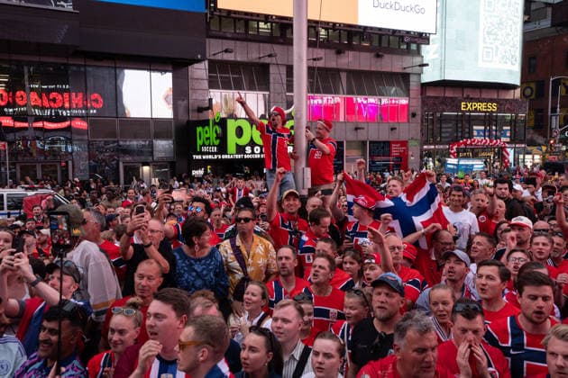 Norway national football team supporters gather in Times Square ahead of World Cup match NEW YORK, UNITED STATES - JUNE 21: Norwegian national football team supporters gather on the iconic red steps in Times Square ahead of Monday s FIFA World Cup match, creating a festive atmosphere with chants and traditional rowing celebrations as fans dressed in red and waving flags filled the famous Manhattan landmark in New York, United States on June 21, 2026. Lokman Vural Elibol Anadolu New York United States. Editorial use only. Please get in touch for any other usage.  Copyright: x2026xAnadoluxLokmanxVuralxElibolx