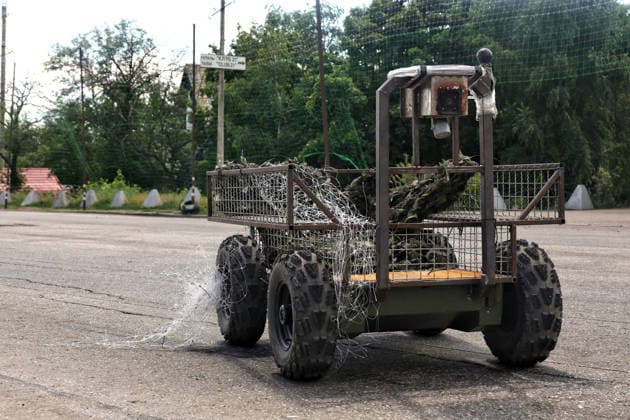 RECORD DATE NOT STATED Ukrainian Military Vehicles Travel Through Donetsk Region - Ukraine A ground drone travels along a road protected by anti-drone nets in Donetsk region, Ukraine, on June 20, 2026 (Photo by Nina Liashonok Ukrinform ABACAPRESS.COM) Odesa Ukraine  Copyright: xLyashonokxNina Ukrinform ABACAx